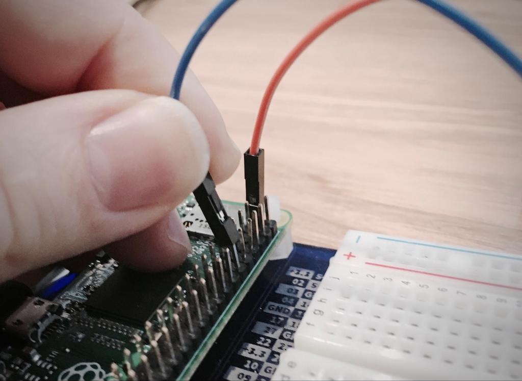 Photo of connecting the wires between the Raspberry Pi and breadboard